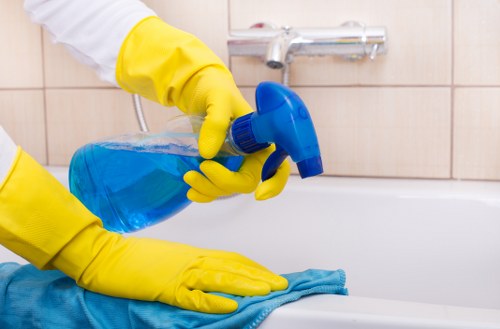 Technician lifting carpet cleaning equipment with care